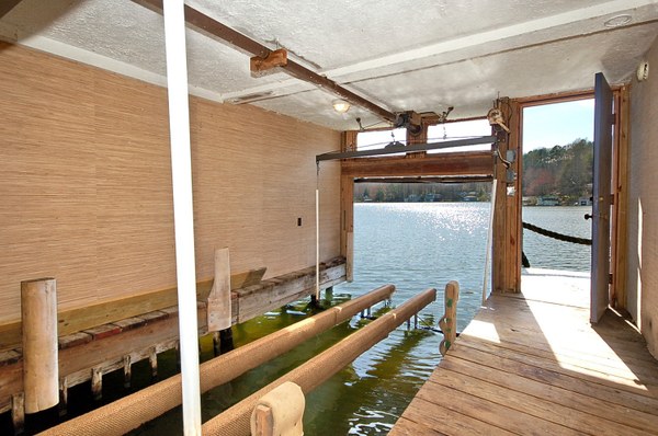 The boat garage is just screaming for that antique Chris Craft boat